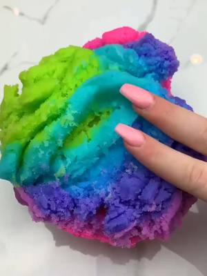 A post by @anqelgluee on TikTok caption: {credits:tibbleslimes} this slime is so pretty! ✨🌈 what does it remind you of? 💘🌻 #foryou #satisfying #slime