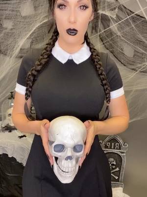 A post by @kristenhughey on TikTok caption: Happy Wednesday 💀 #cosplay #wednesdayaddams #halloween #wednesdayaddamscosplay