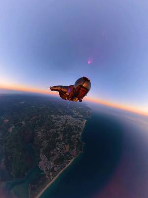 A post by @birdiesebastian on TikTok caption: Feel this sunset of the earth🌞#wingsuit #skydive #challenge #foryou #adventure #sunset