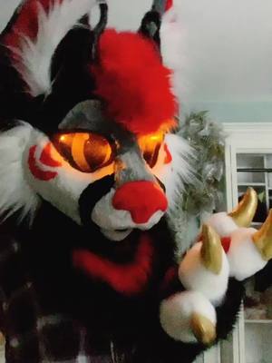 A post by @artemisflame on TikTok caption: Dino-Lynx Tingz ✨ #furry #fursuit #furryfandom #fursuiter #fursuitmaker #foryou #fyp #animalsoftiktok