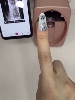 A post by @jaimeruz5 on TikTok caption: Wanna your favorite photo print on your finger #creativeideas #catlovers #doglovers