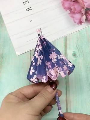 A post by @michellesales02 on TikTok caption: Do u need an 🌂🌂🌂 #DIY #origami #origamitutorial #tiktokdiy #foryoupage