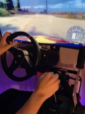 A post by @spexdealer on TikTok caption: Wait for the Hit 🙈#vibewithme #mycrib #fanatec #simracing #savethemanual