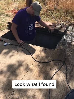 A post by @garrettpenney on TikTok caption: When stuck at home, clean the water storage tank #fyp #foryoupage #water #work #mud #cowboy #Home