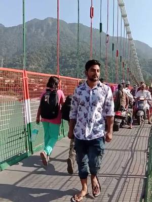 A post by @choudharykooner on TikTok caption: #uttrakhand #risikesh #ramjhula #bridge #risikeshdiries #utrakhandlover #utrakhandsong #haryana