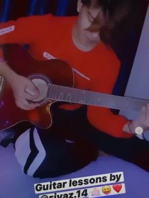 A post by @rii_014 on TikTok caption: Rii playing guitar🎸@riyaz.14 #loveyouall💕 #blackfam #foryoupage #duetwithriii #riyaz