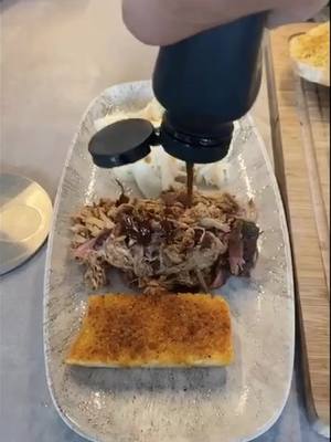 A post by @gustavschaefer on TikTok caption: Pulled Pork and Cole Slaw in time lapse. Enjoy. #pulledpork #bbq #dinnertime