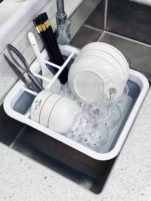 A post by @uncleballon on TikTok caption: comment "yes" if you like it 😙😙 #dishware #storage #drain #rack 😂😂 #goodthing #fyp 😊😊