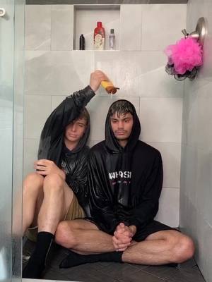 A post by @edtertaining on TikTok caption: just two homies chillin in the shower fully clothed and some shampoo @zachclayton