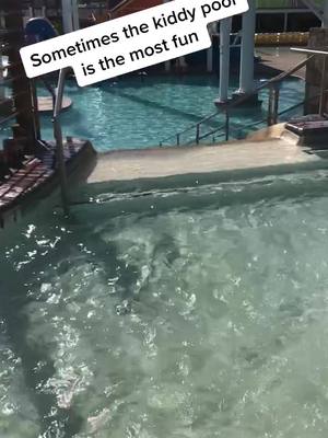 A post by @garrettpenney on TikTok caption: Sometimes playing in the kiddy pool is the most fun #pool #sunsplash #fyp #foryoupage #water #slide #kids #sun