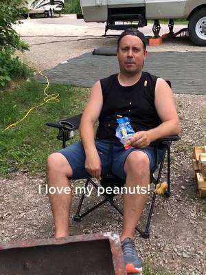 A post by @upandplay on TikTok caption: A Dad in the wild!! 🌲 #DadsOfTikTok #summer2020 #familydinner #camping #campinglife #peanuts