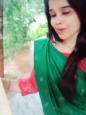 A post by @miyamithra on TikTok caption: മഴയും ഈ പാട്ടും കൂടി ആയപ്പോ വല്ലാത്തൊരു feeling.... 😍😍😍#chunkzz  #red🌹rose #luttappy_007  #cappuccino❤ #one2one007