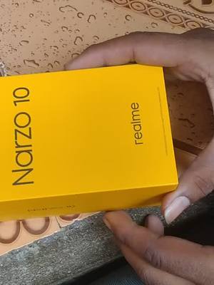 A post by @poonamkagadiya on TikTok caption: #my new phone( realme narzo 10)