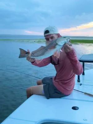 A post by @gabelefebvre on TikTok caption: Buzzer beater! ⚡️ #fyp #foryou #storm #fishing #outside #fly #florida #2020 #water #redfish #sunset #ocean #free #america