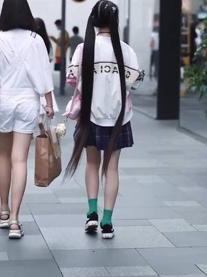 A post by @easyandfree_007 on TikTok caption: Do u want to long hairs 😂so long 🤣#longhair #girl #street #hairstyle #fyp #foryoupage #followme