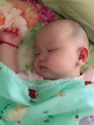 A post by @cutiebabyleague on TikTok caption: you never know how the baby sleeps under the quilt#baby #cutie