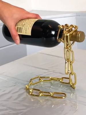 A post by @hygoshop on TikTok caption: This chain holds your wine 🍷😱 #fyp #foryoupage #wine #winewednesday #wine #fleetwoodmac #viral #wineholder #fypシ