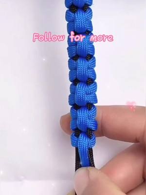 A post by @origamihero on TikTok caption: Have you learned it? 🥳. #weave #bracelet #knittingrope #TimeforTENET