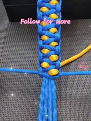 A post by @origamihero on TikTok caption: Is it beautiful? Have you learned it? #weave #bracelet #ShowAndTell