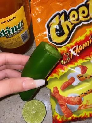 A post by @jn.munooz on TikTok caption: 🌶🔥#fyp #jalapeñochallenge #flaminghotcheetos