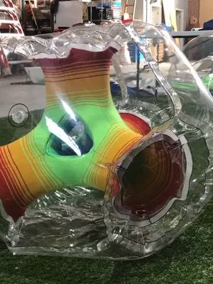 A post by @pneuhaus on TikTok caption: For your viewing pleasure #oddlysatisfying #inflatable #art #wip #color #spectrum #knit #fyp