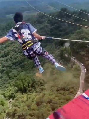 A post by @outdoorshoot01 on TikTok caption: 😁#bungeejumping #travel #fyp