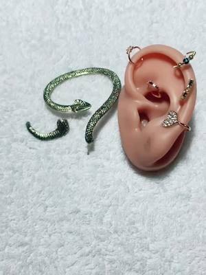 A post by @angelegauths on TikTok caption: snake  earrings. so  beautiful.