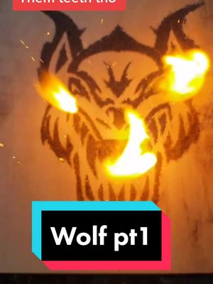 A post by @sattar_labs on TikTok caption: It's been a minute. What should I burn next? #fyp #tattoo #gunpowder #artist #pewpewpew #wolf #woodworking