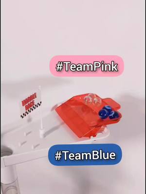 A post by @premiermarbleracing on TikTok caption: #sponsored by @step #marblerace between #teamblue and #teampink - who's winning this thing? #marblerun #step #marbles