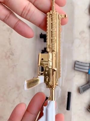 A post by @m762gun on TikTok caption: Gun model #pubgmodel #pubgkeychains #model #toy