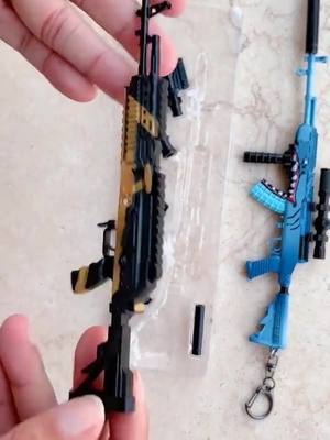 A post by @awmgunmodel on TikTok caption: Small gun model #model #toy #gunmodel #pubgkeychain