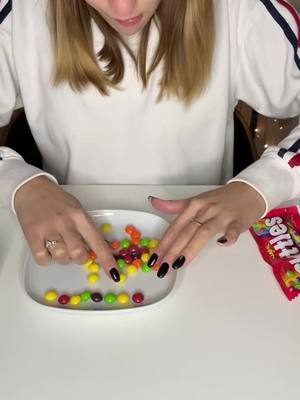 A post by @darimkoo on TikTok caption: New rainbow 🌈 experiment with @skittles Try with your kids 👶 🧒