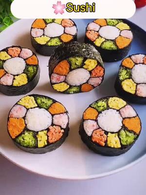 A post by @gardenfood1 on TikTok caption: Do u like this rainbow Sushi?😋😋😋#Foodie #FoodLover #rainbow #sushi