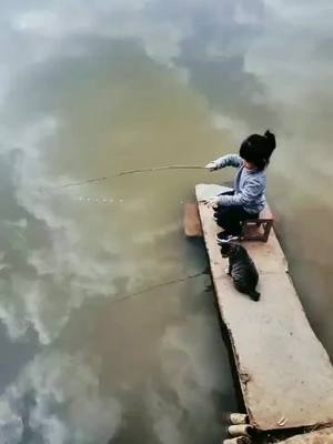 A post by @lovefishing123 on TikTok caption: The little girl fishing for the first time was lucky! Declare that this is an adult in the side watch fishing, to ensure safety!##Outdoors#fishing