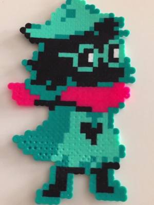 A post by @amorecreativeray on TikTok caption: fluffy boy!! #perler #perlerbeads #art #satisfying #fyp #foryou #foryoupage #cute #ralsei #deltarune #deltaruneralsei #undertale