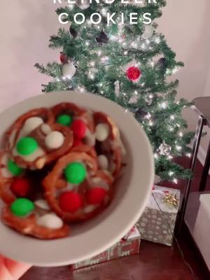 A post by @missavry on TikTok caption: | REINDEER COOKIES | 1st put the pretzels with hugs on top in the oven at 200 F for 8 min! 2nd put the final product in freezer for a few hours! DONE!