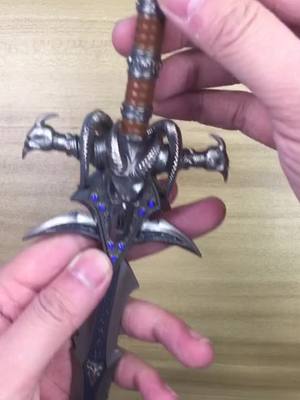 A post by @m762gun on TikTok caption: #wow #worldofwarcraft #lichking #frostmourne #swordmodel #unboxing   About 15”  frostmourne alloy model. 🔥