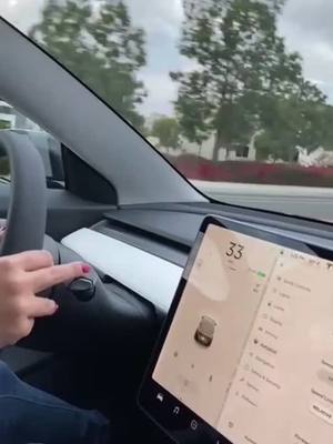 A post by @sarenamezzacappa on TikTok caption: My dad’s videotaping me like we are still in the 90s 😂😂 #newcar #tesla2021 #italiandads #fyp #tesla #teslamodel3