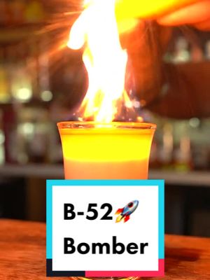 A post by @raiscuisine on TikTok caption: B-52 Bomber🚀, comment if you’d have a shot🍾 #b52 #cocktail #wine #cocktailfire #bomber