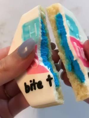 A post by @cookiesbyally on TikTok caption: He or she, bite to see #cookiedecorating  #cookies #cookievideos #cookiedecoratingvideos #genderreveal