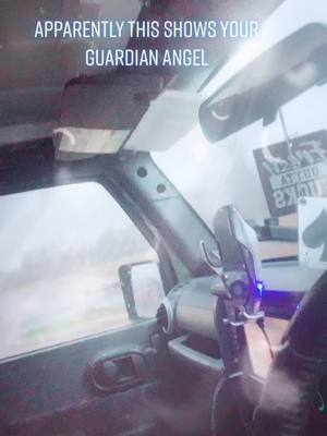 A post by @prettylittlepsycho97 on TikTok caption: I tried a couple times and barely got a split second of the wings from the front of my car so I tried the back and this happens #guardianangel