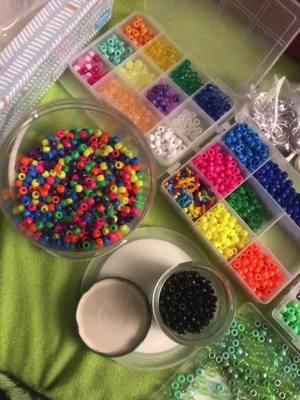 A post by @xxkayden_angelxx on TikTok caption: I was tryna show off my beads and then spilled them all over the fucking floor lmao #kandi #scene #scenecore #sceneboy #scenekid