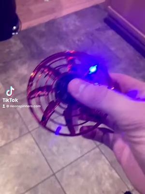 A post by @neonspinners.com on TikTok caption: Get yours at NeonSpinners.com 🚀 #fyp #fidgetspinners