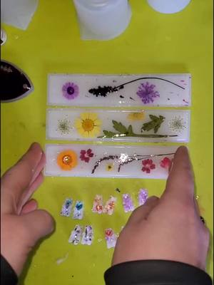 A post by @craftylt on TikTok caption: #milkyflower #resin #bookmark