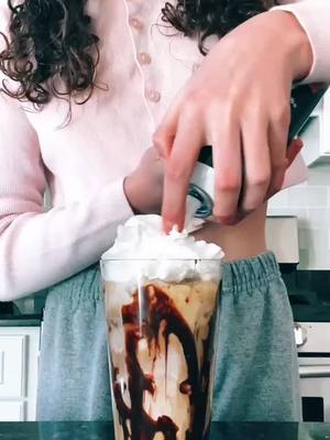 A post by @coffeewithbesties on TikTok caption: the whipped cream got in my finger ahhaa #QuickerPickerRapper #icedcoffee #aesthetic #4you #grwm #coffeeaddict