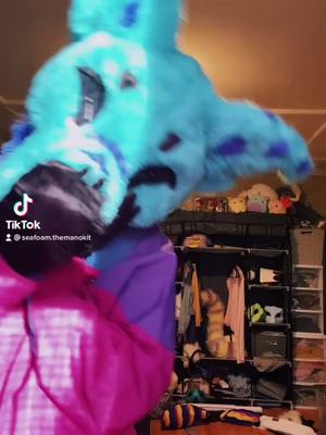 A post by @spacecadet.kalypso on TikTok caption: GUYS. LOOK WHO CAME!!💙🌊 welcome home, seafoam! #furry #furryfandom #furries #fursuit #fyp