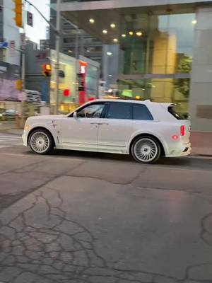 A post by @spexdealer on TikTok caption: White on white #rollsroyce #cullinan #torontocarspotting #drake