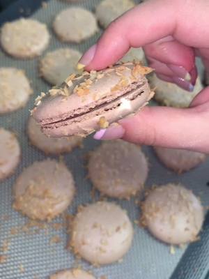 A post by @macaretto_ on TikTok caption: Chocolate coconut macarons 🥥🍫 #fypシ #fyp #sidetable #HomeBuisness #inspirationalquotes #macaron