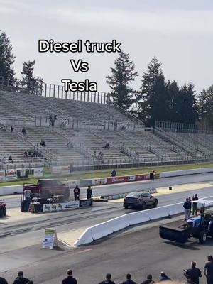 A post by @nazzz21 on TikTok caption: Diesel or electric? 🤔 #dieseltrucking #tesla #electric #race #fyp