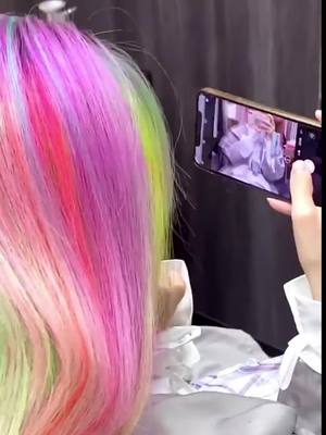 A post by @fleesse.advolla644 on TikTok caption: Rainbow hair color#hairstyles #fashion #fyp #foryou